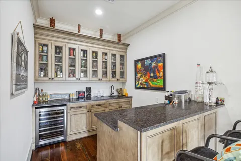 a kitchen with stainless steel appliances a sink stove and cabinets