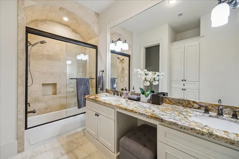 a bathroom with a granite countertop sink mirror and a