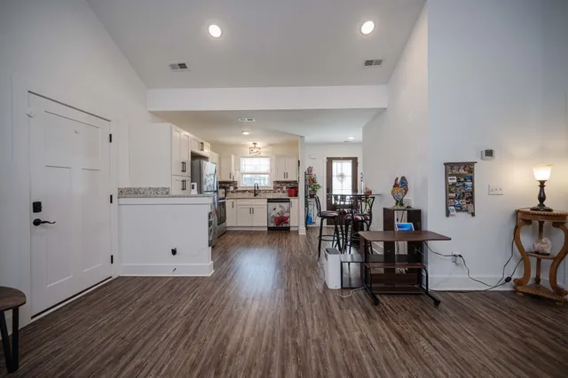 a view of a kitchen and dining room