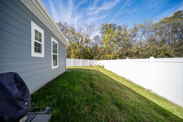 a view of a backyard with garage