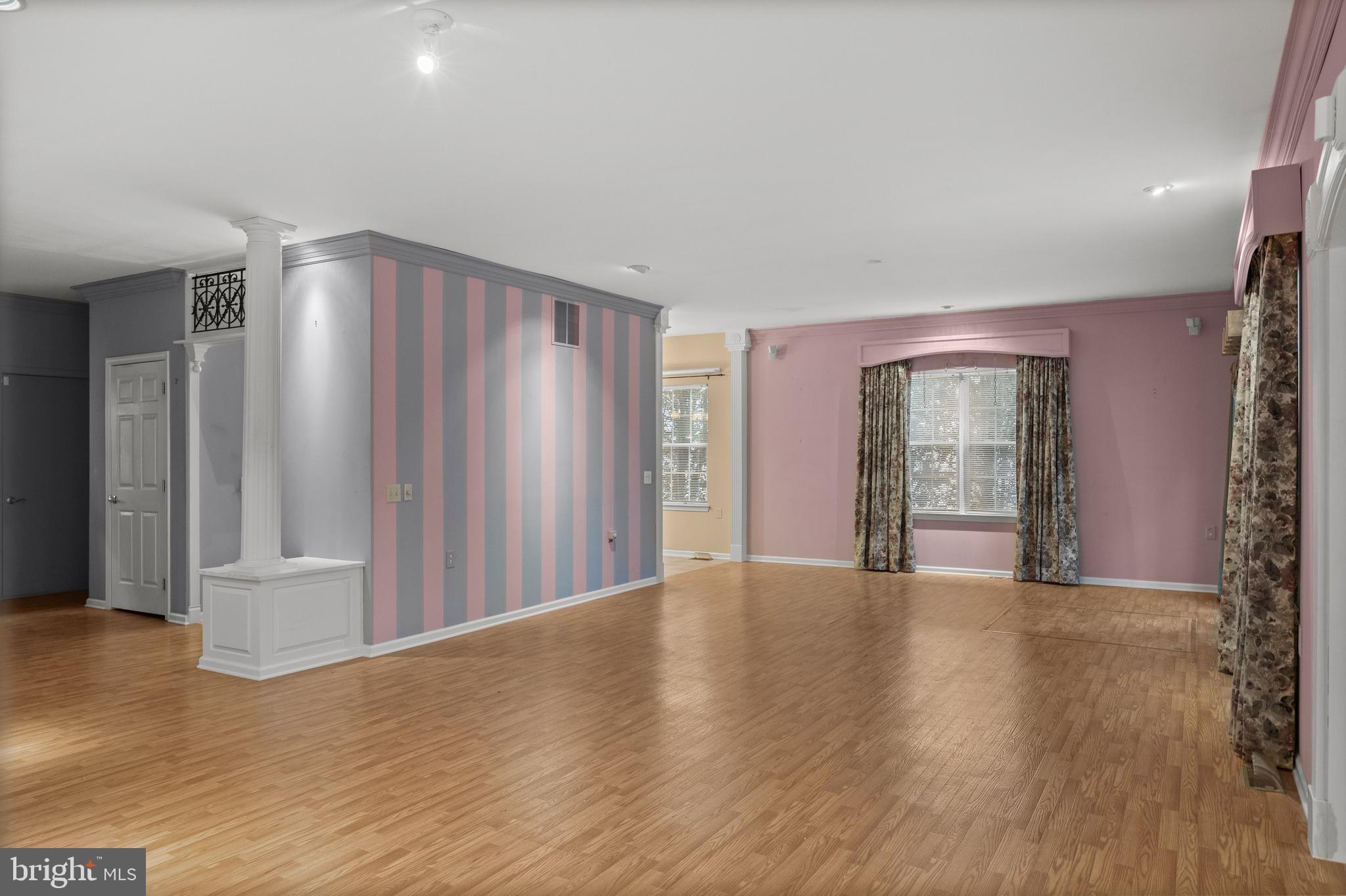 4 Tara Lane Delran, NJ 08075 - Photo 5 of 36 a view of an empty room with wooden floor and a window