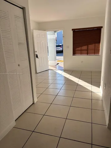 a kitchen with granite countertop a stove a refrigerator and a sink