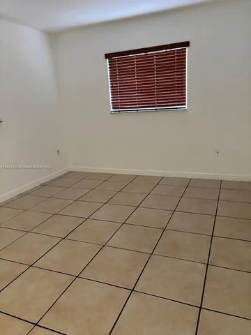 a view of kitchen with furniture and window