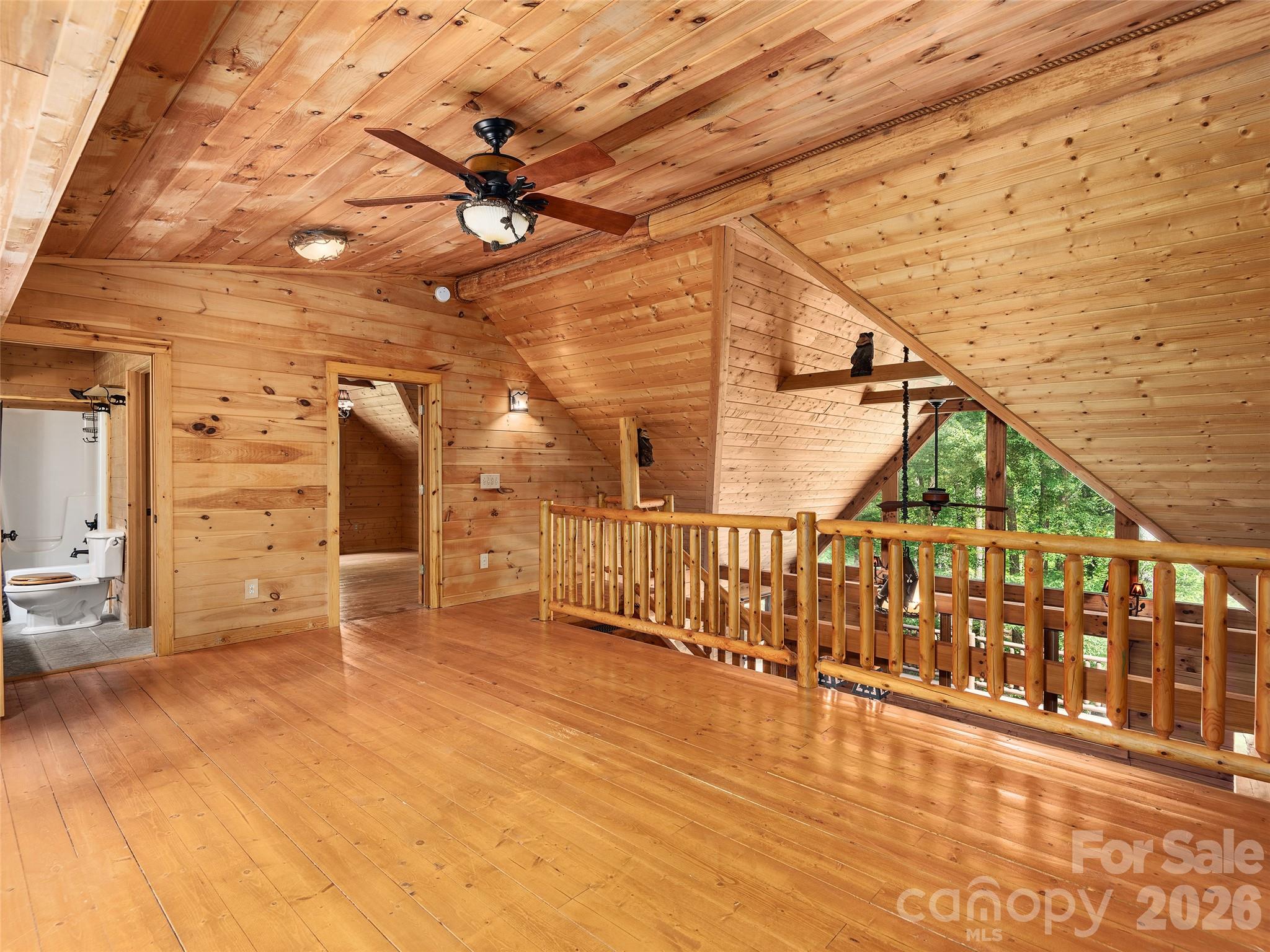 413 Green Hills Road Mill Spring, NC 28756 - Photo 24 of 48 a view of a balcony with car parked