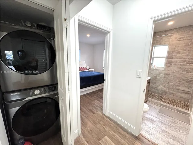 a view of a hallway with washer and dryer