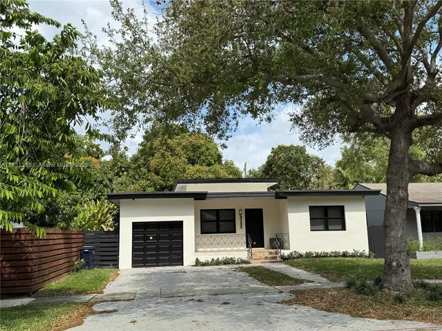 a front view of a house with yard