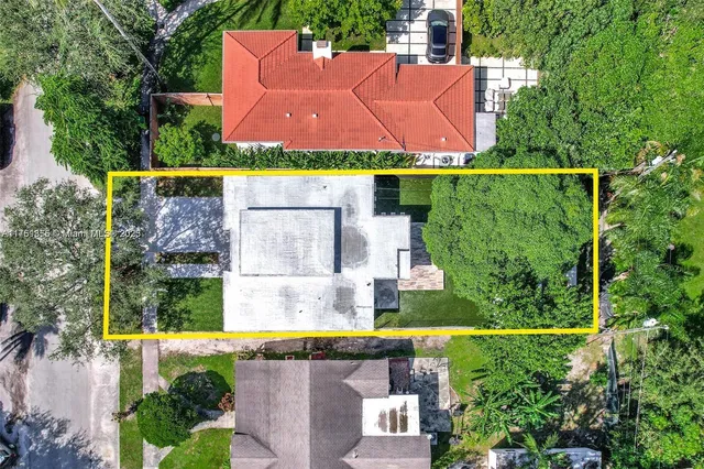 an aerial view of house with swimming pool outdoor seating and yard