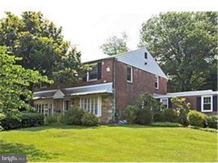 320 Gribbel Road Wyncote, PA 19095 - Photo 1 of 24 a front view of a house with a yard and green space
