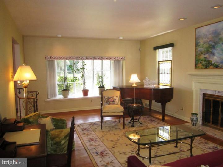 320 Gribbel Road Wyncote, PA 19095 - Photo 2 of 24 a living room with furniture and a fireplace