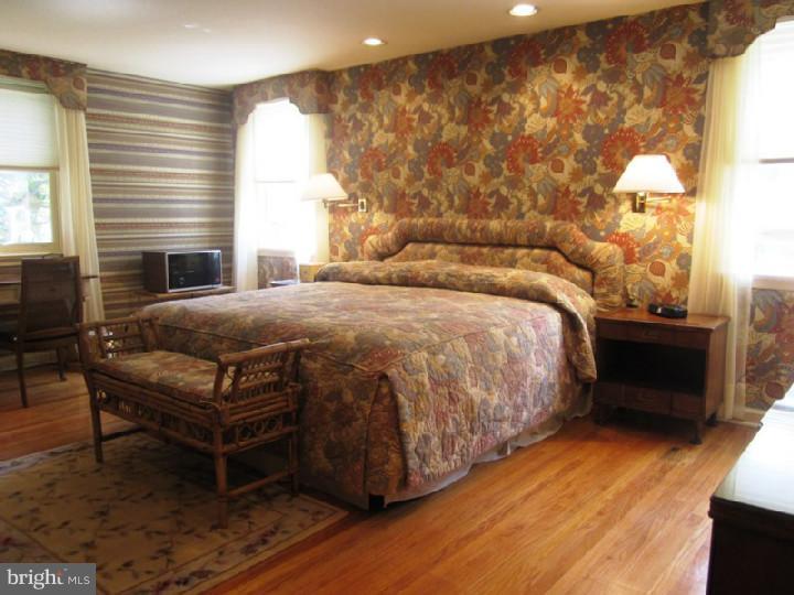 320 Gribbel Road Wyncote, PA 19095 - Photo 12 of 24 a bedroom with a bed and a night stand