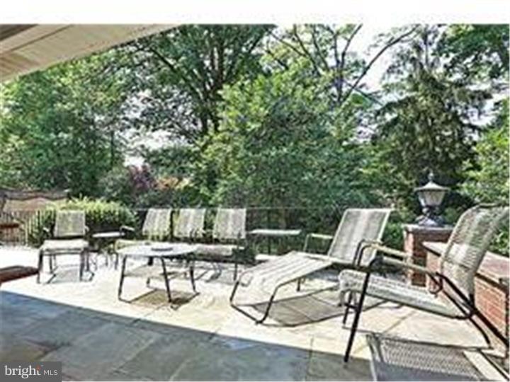 320 Gribbel Road Wyncote, PA 19095 - Photo 21 of 24 a view of backyard with a table and chairs