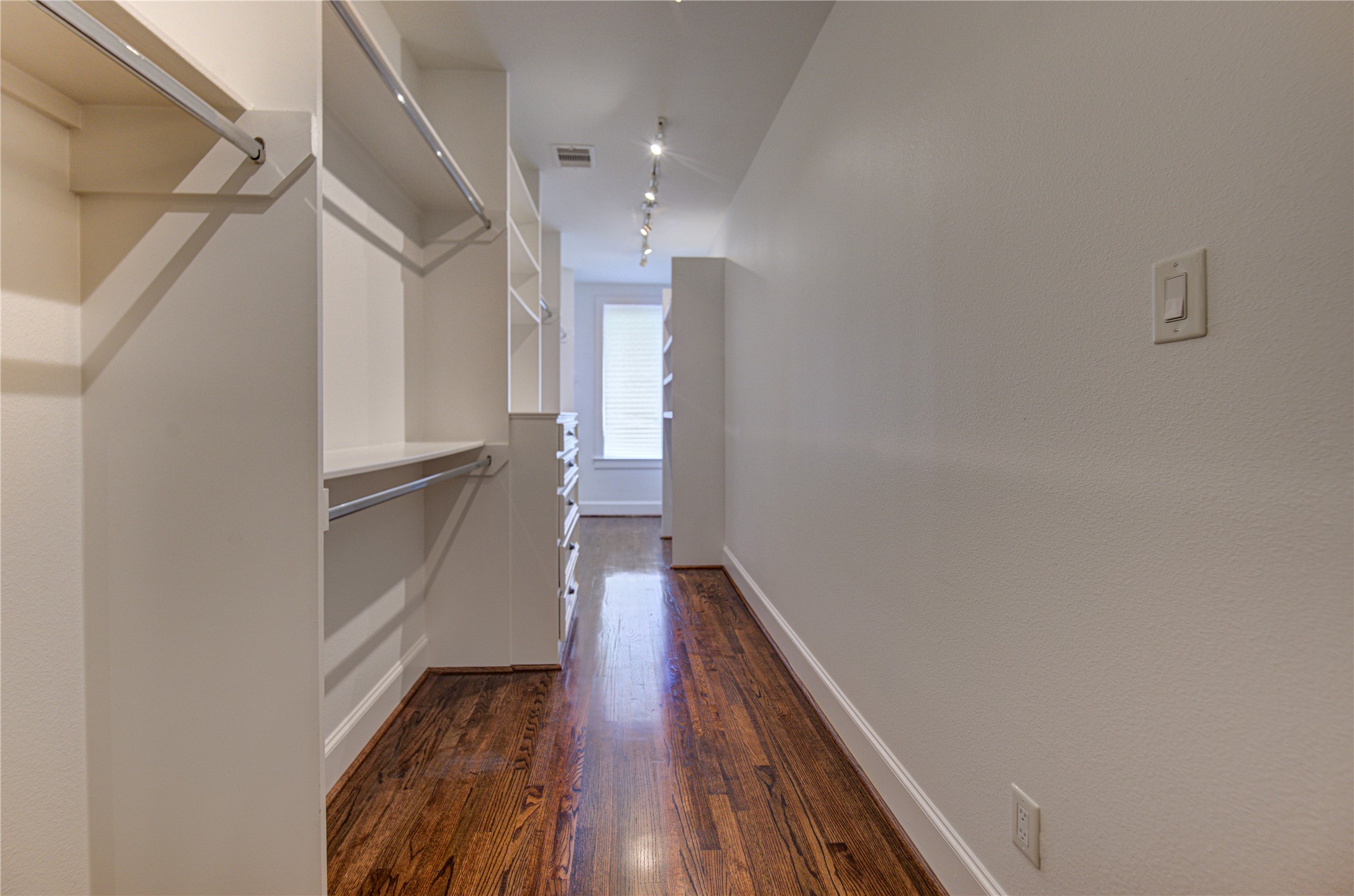 6520 Rodrigo Street Houston, TX 77007 - Photo 21 of 44 Expansive walk-in primary closet with custom built-ins and extensive storage.