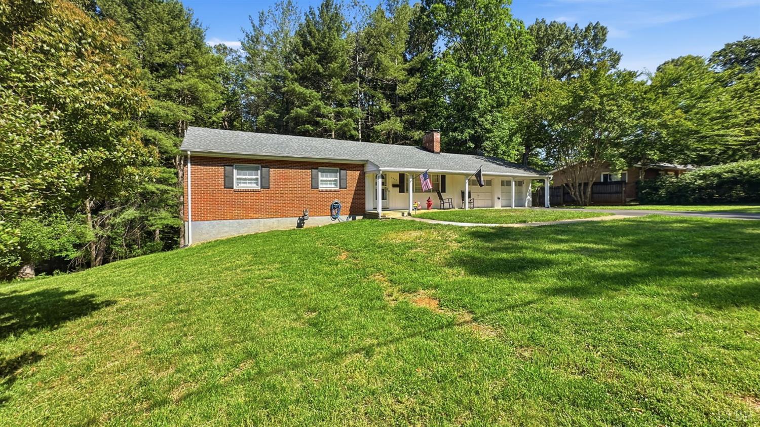 2044 Indian Hill Road Lynchburg, VA 24503 - Photo 30 of 30 a front view of a house with a yard and trees