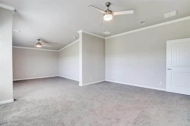 an empty room with a ceiling fan and a ceiling fan