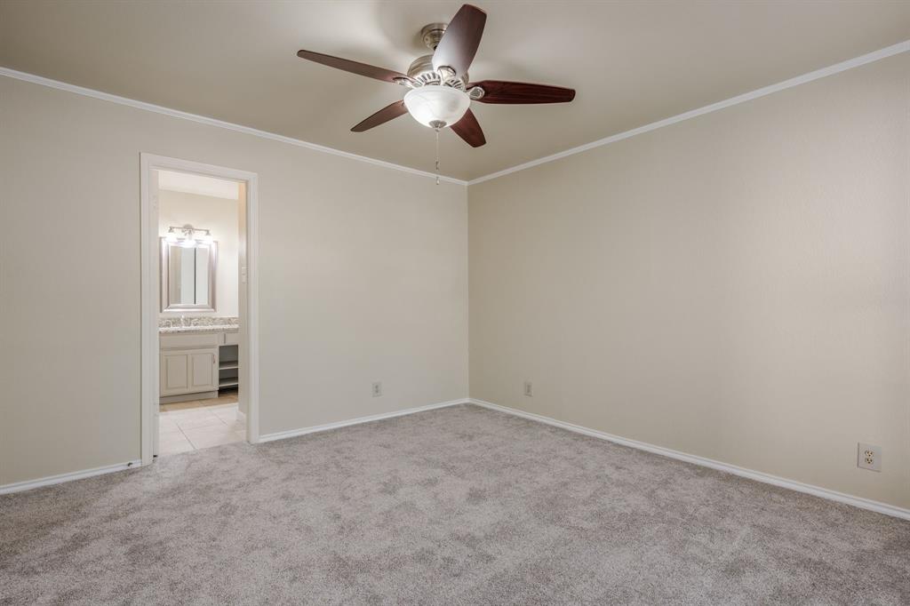 5200 Martel Avenue, Unit 37C Dallas, TX 75206 - Photo 11 of 26 an empty room with closet and windows