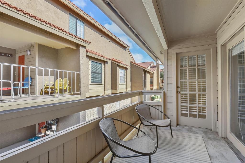5200 Martel Avenue, Unit 37C Dallas, TX 75206 - Photo 17 of 26 a view of a chair and table in a balcony