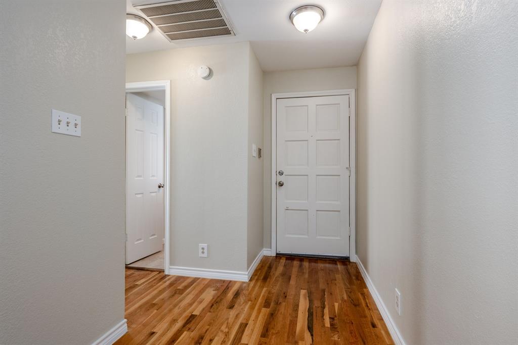 5200 Martel Avenue, Unit 37C Dallas, TX 75206 - Photo 4 of 26 a view of a room with wooden floor and closet