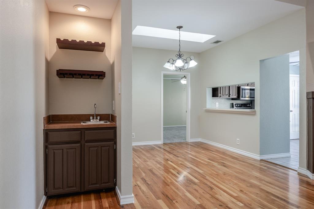 5200 Martel Avenue, Unit 37C Dallas, TX 75206 - Photo 5 of 26 a bedroom with a bed and a dresser