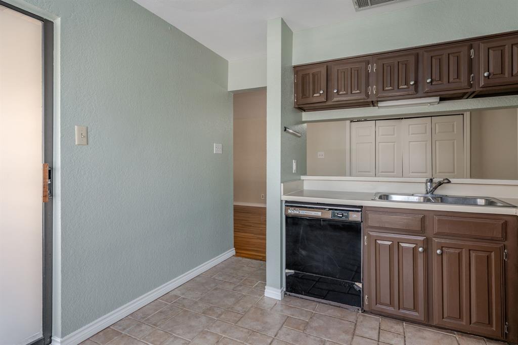 5200 Martel Avenue, Unit 37C Dallas, TX 75206 - Photo 9 of 26 a kitchen with granite countertop a stove and a sink