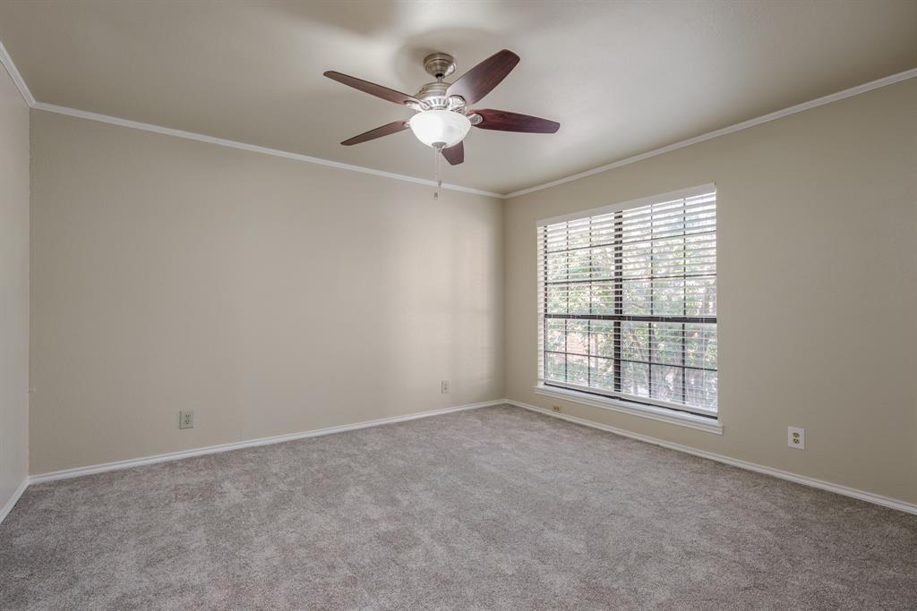 5200 Martel Avenue, Unit 37C Dallas, TX 75206 - Photo 10 of 26 an empty room with ceiling fan and window