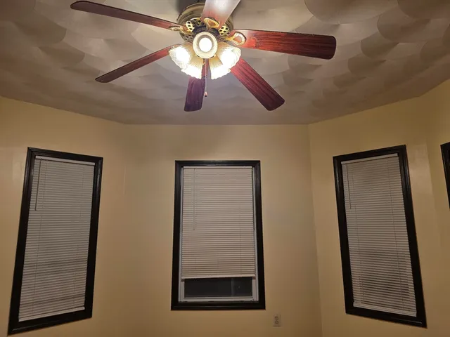 a view of a hallway with a fan