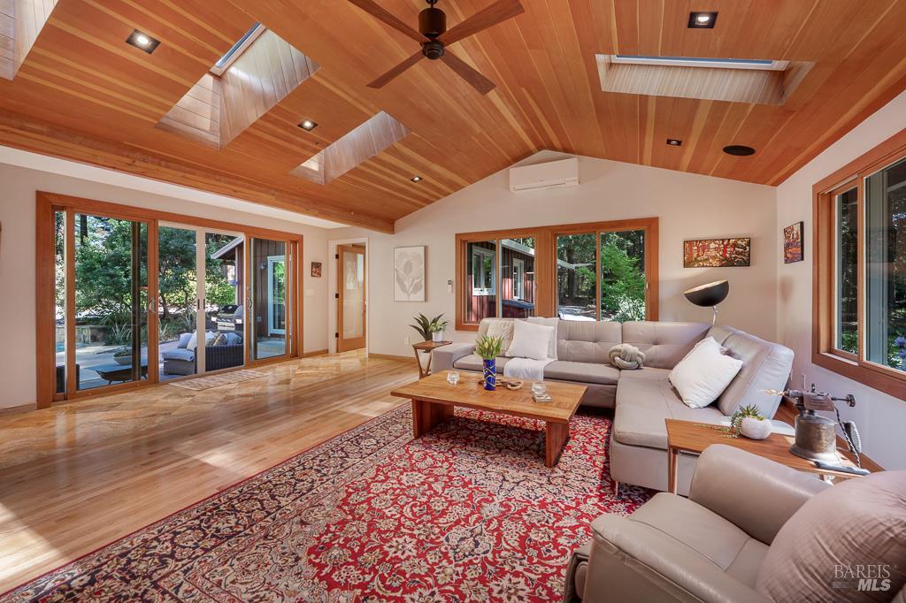 17600 Willow Creek Road Occidental, CA 95465 - Photo 13 of 79 Oak floors transitioning to travertine tile.