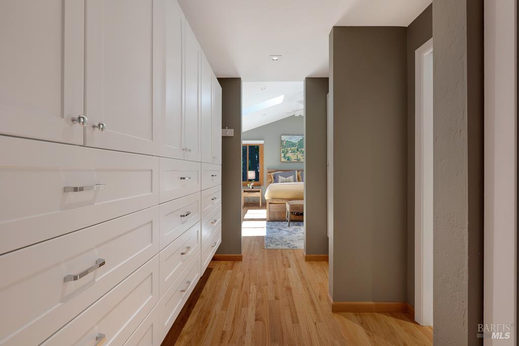 17600 Willow Creek Road Occidental, CA 95465 - Photo 33 of 79 Private hallway leading to primary bedroom with closet and built-ins!