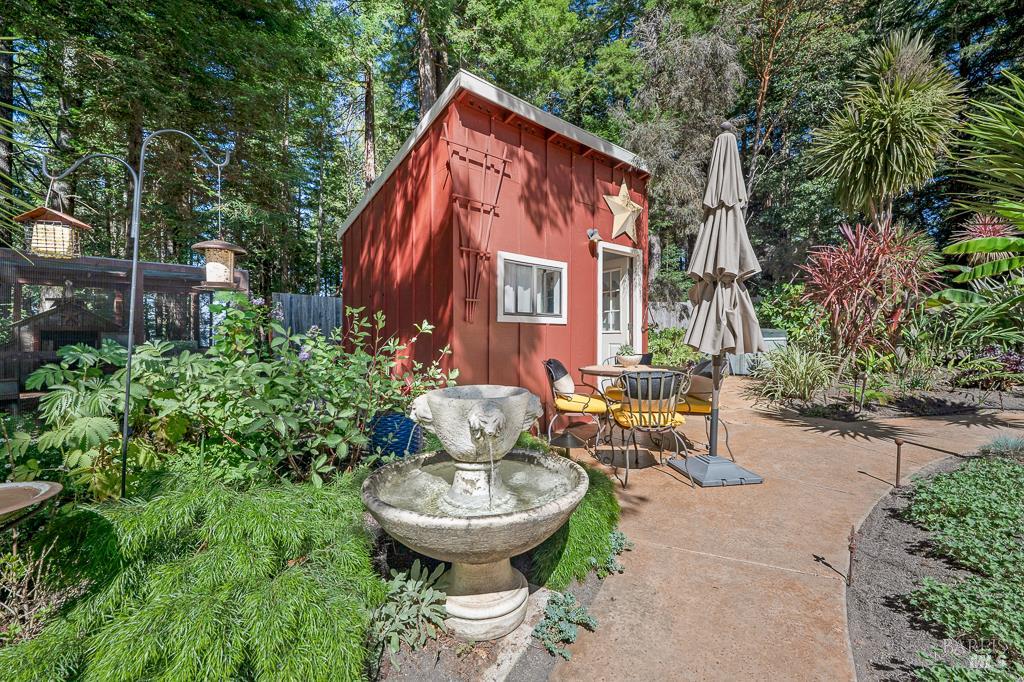 17600 Willow Creek Road Occidental, CA 95465 - Photo 53 of 79 Meandering path to the bunkhouse, Hot tub and outdoor shower. Hummingbirds LOVE the fountain.