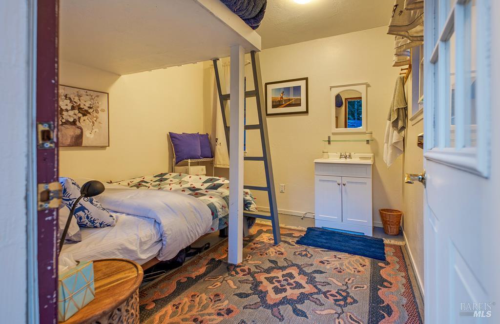 17600 Willow Creek Road Occidental, CA 95465 - Photo 55 of 79 Bunkhouse interior with vanity.