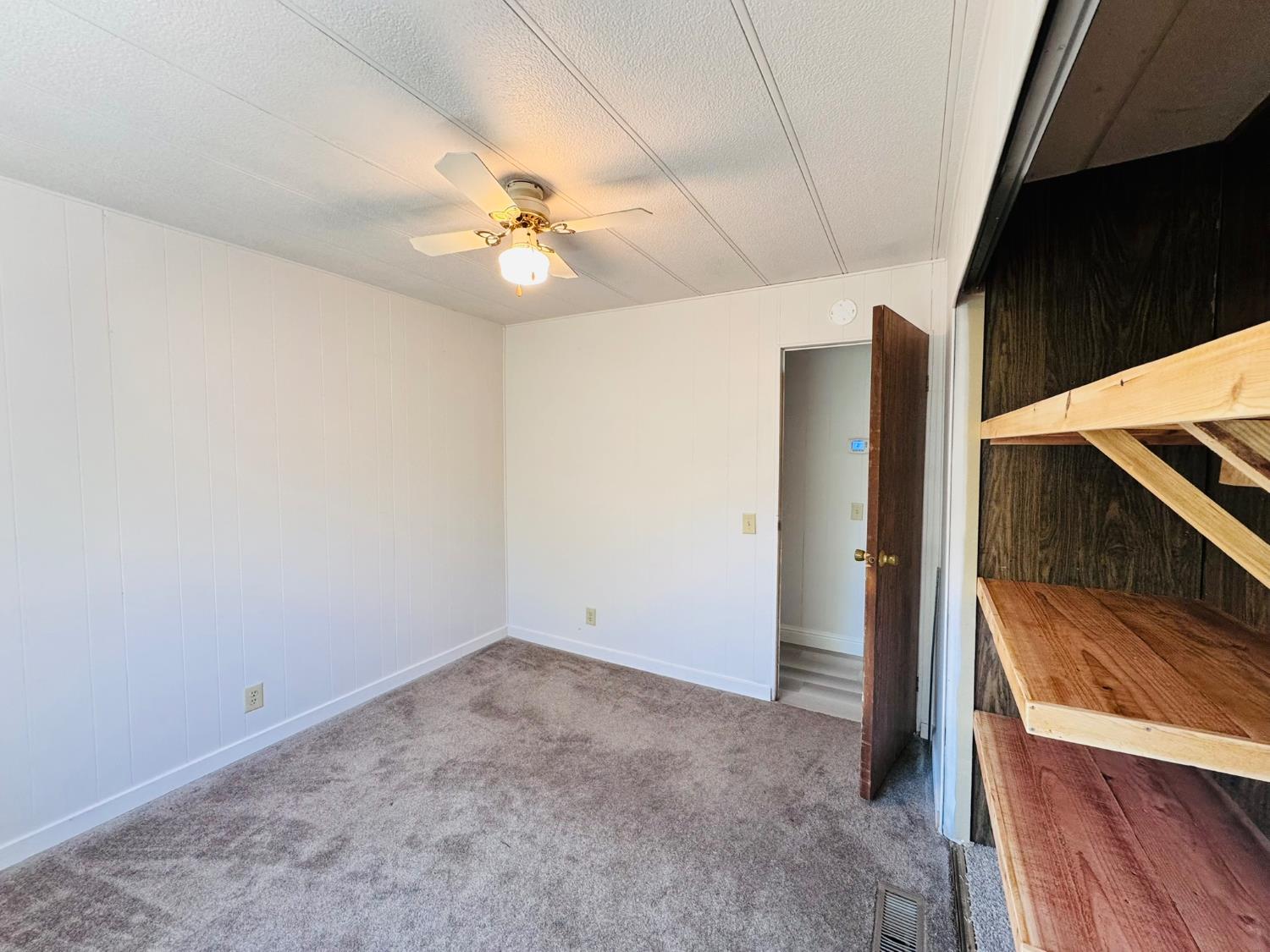 3901 West Lake Road, Unit 123 West Sacramento, CA 95691 - Photo 13 of 26 a view of an empty room with a ceiling fan