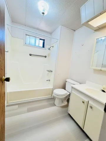 an empty room with a empty space and windows