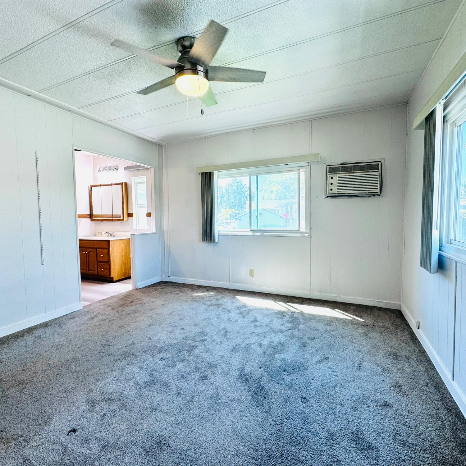 3901 West Lake Road, Unit 123 West Sacramento, CA 95691 - Photo 15 of 26 an empty room with a empty space and windows