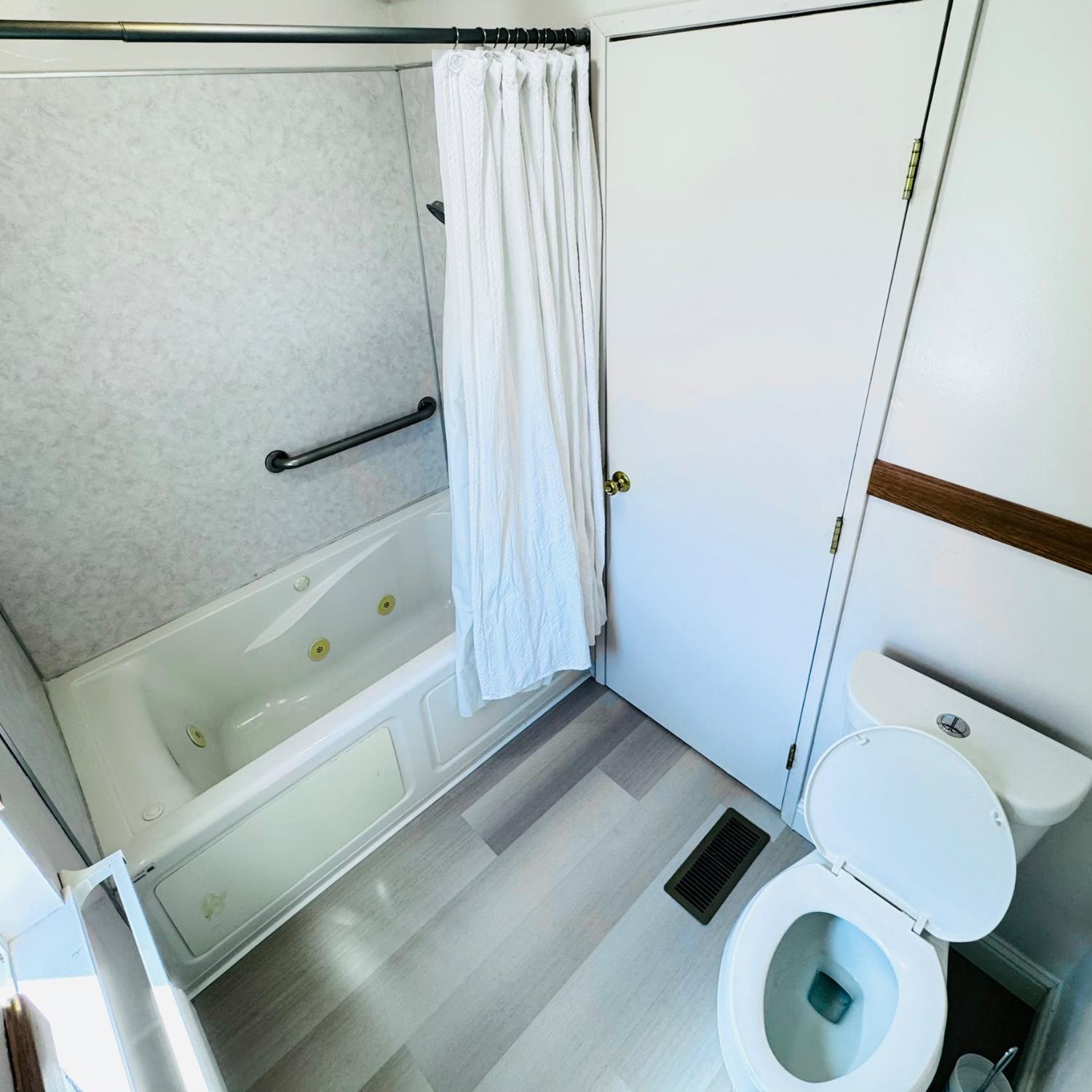 3901 West Lake Road, Unit 123 West Sacramento, CA 95691 - Photo 18 of 26 a bathroom with a tub and a shower