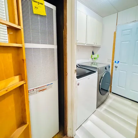 a view of a lake with houses in the back