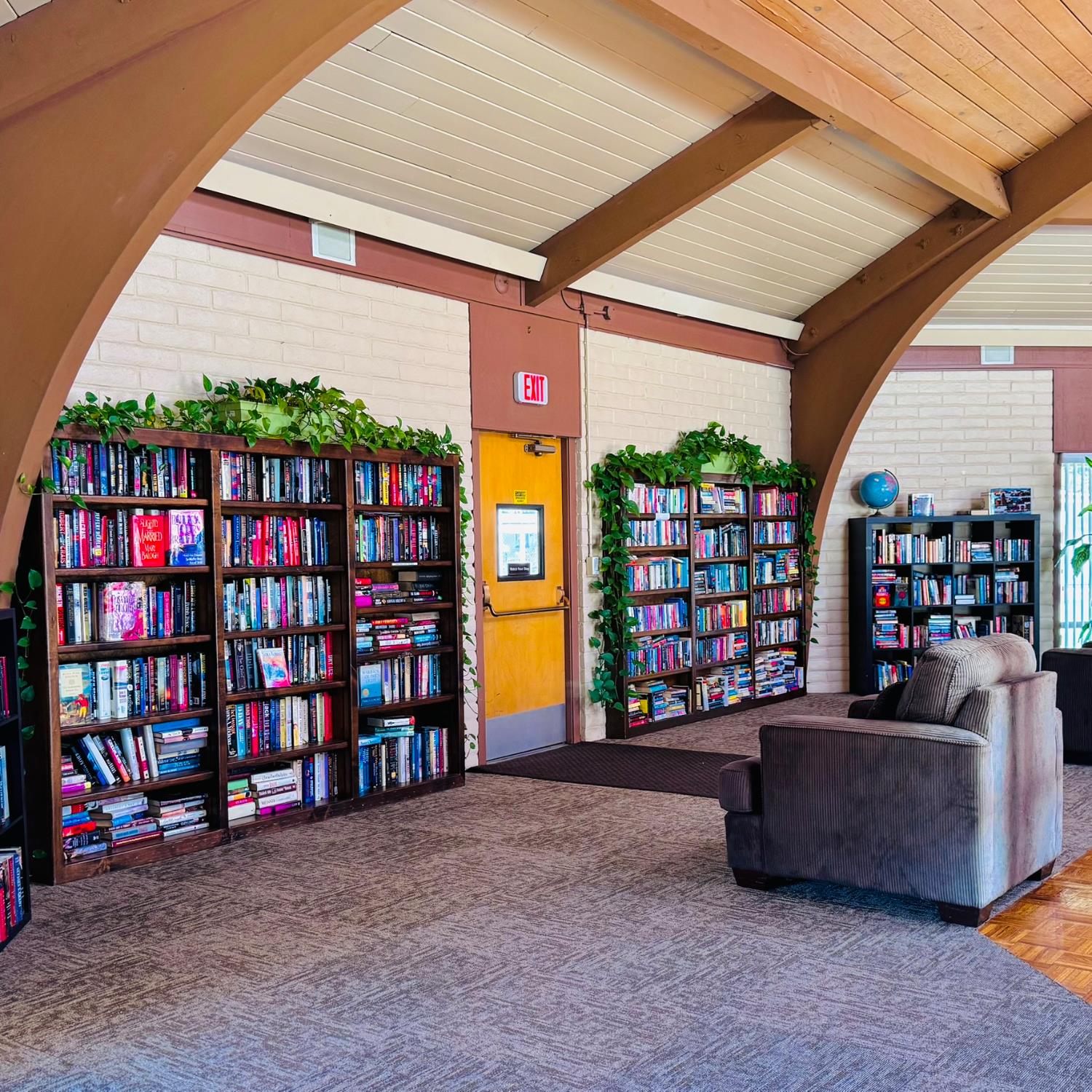 3901 West Lake Road, Unit 123 West Sacramento, CA 95691 - Photo 24 of 26 a living room with balcony a couch and bookshelf