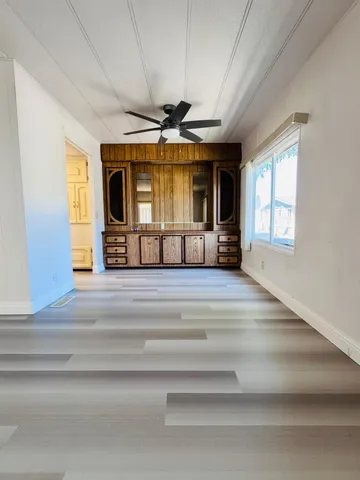 a kitchen with stainless steel appliances a stove a sink and a refrigerator