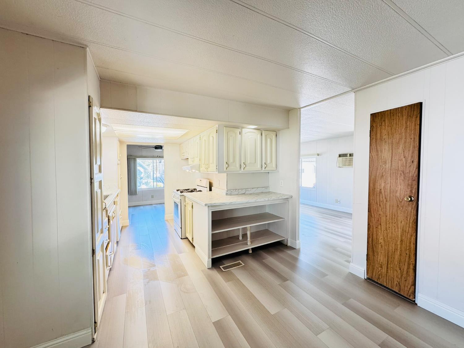 3901 West Lake Road, Unit 123 West Sacramento, CA 95691 - Photo 9 of 26 a view of a room with wooden floor and window