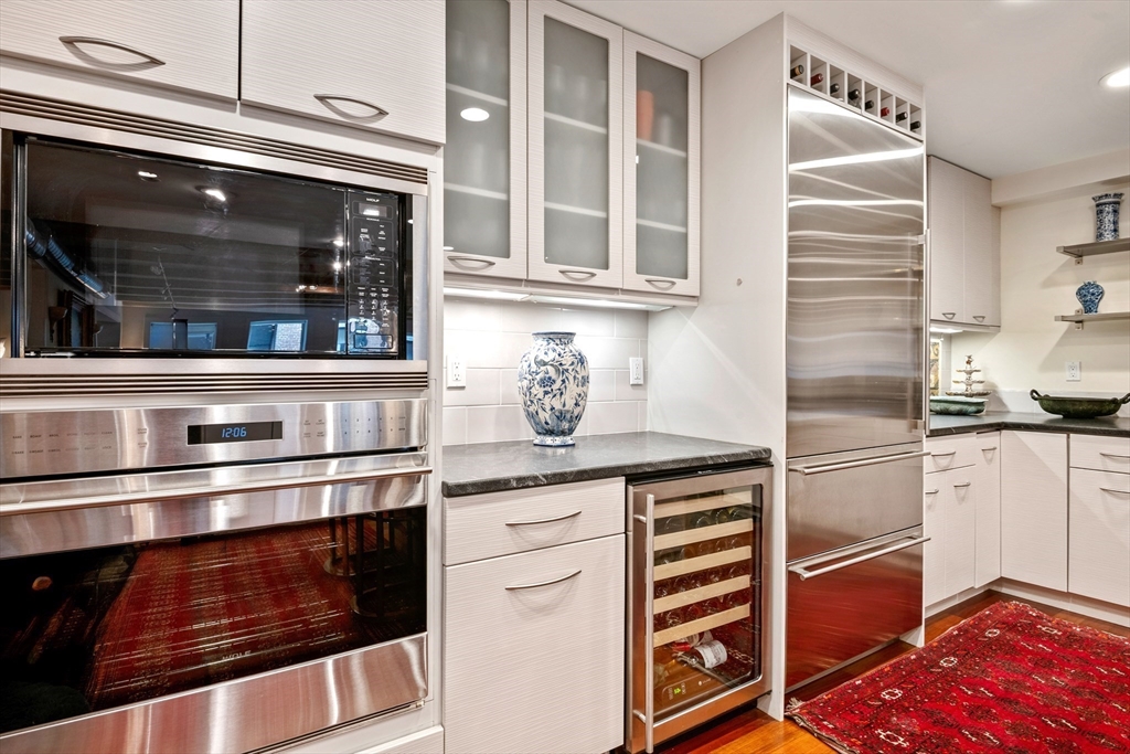 1 Winter Place, Unit 3 Boston, MA 02108 - Photo 13 of 38 a kitchen with appliances cabinets and a sink