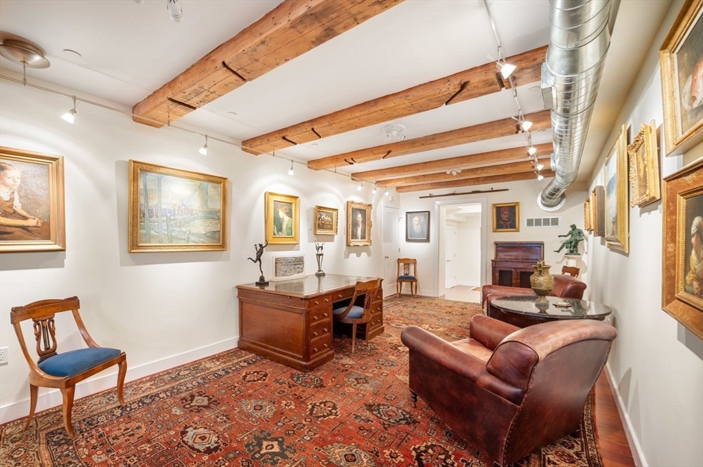 1 Winter Place, Unit 3 Boston, MA 02108 - Photo 19 of 38 a living room with furniture and a chair