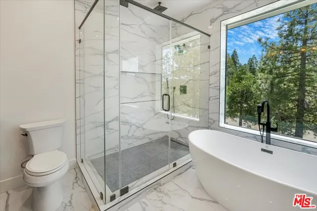 a view of an house with backyard porch and entertaining space