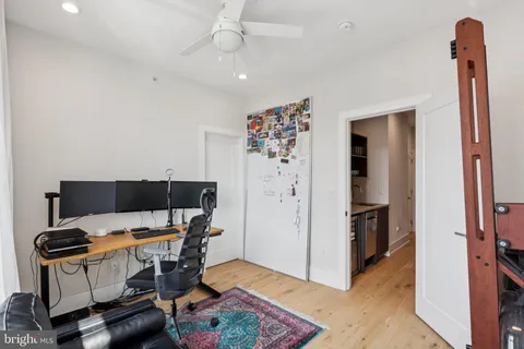 a bedroom with a bed and lamp