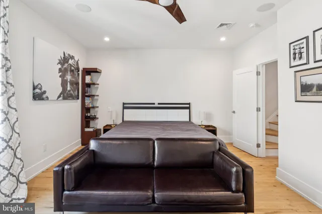 an outdoor living room with patio furniture and a couch