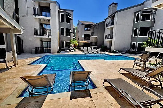 a view of a patio with table and chairs couches with wooden floor