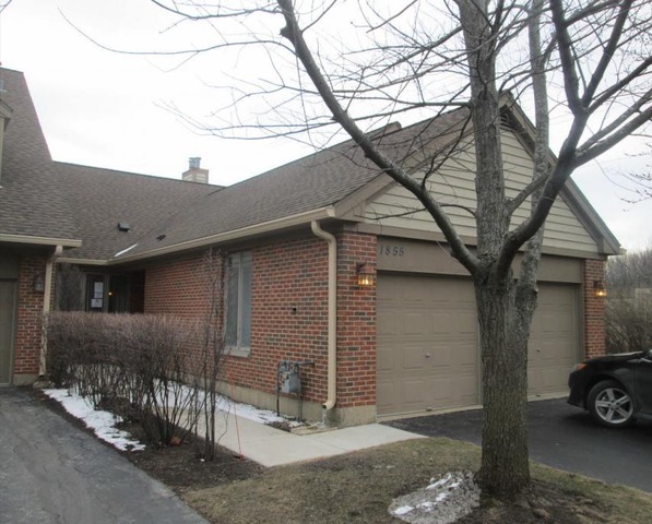 1855 Koehling Road Northbrook, IL 60062 - Photo 1 of 17 a car parked in front of a house