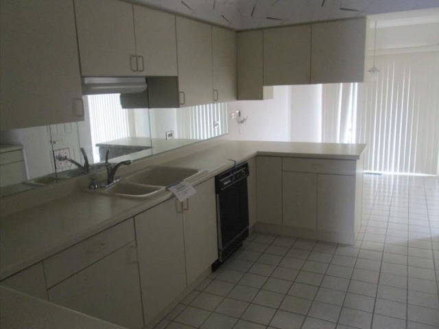 1855 Koehling Road Northbrook, IL 60062 - Photo 3 of 17 a kitchen with a sink a cabinets and window