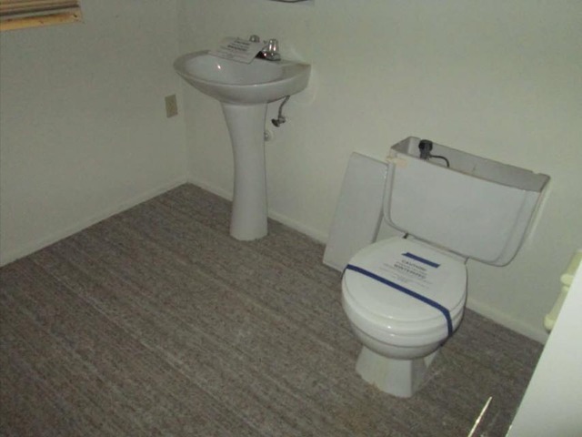 1855 Koehling Road Northbrook, IL 60062 - Photo 10 of 17 a white toilet sitting next to a white sink