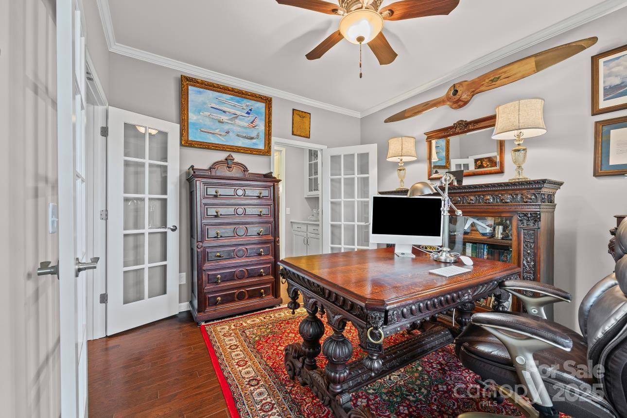 276 Grovefield Drive Fort Mill, SC 29715 - Photo 12 of 44 a workspace with furniture and wooden floor