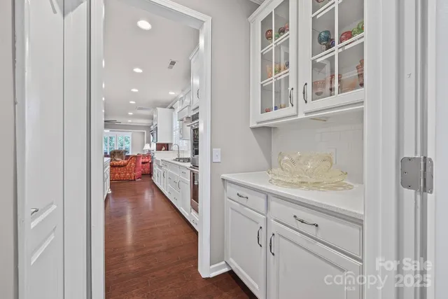 a view of hallway with livingroom and furniture