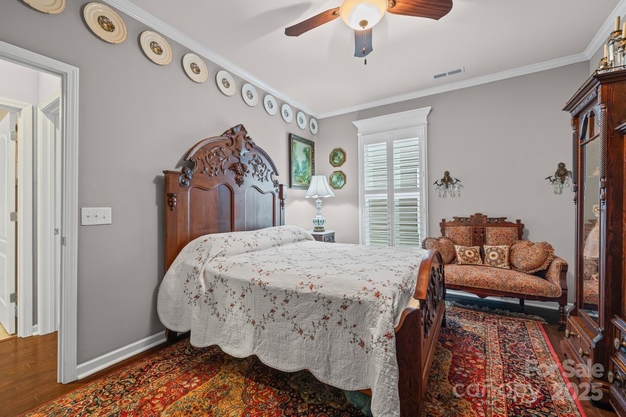 276 Grovefield Drive Fort Mill, SC 29715 - Photo 23 of 44 a bed room with a bed and a couch
