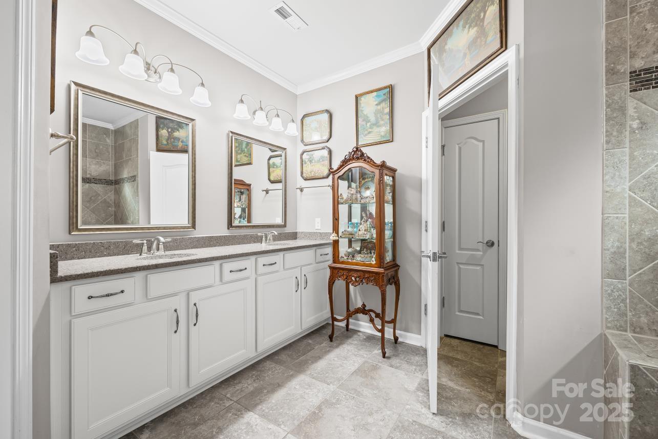 276 Grovefield Drive Fort Mill, SC 29715 - Photo 29 of 44 a spacious bathroom with a mirror and a sink